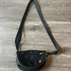 Lululemon Athletica Black and Gold Crossbody Bag with Adjustable Strap